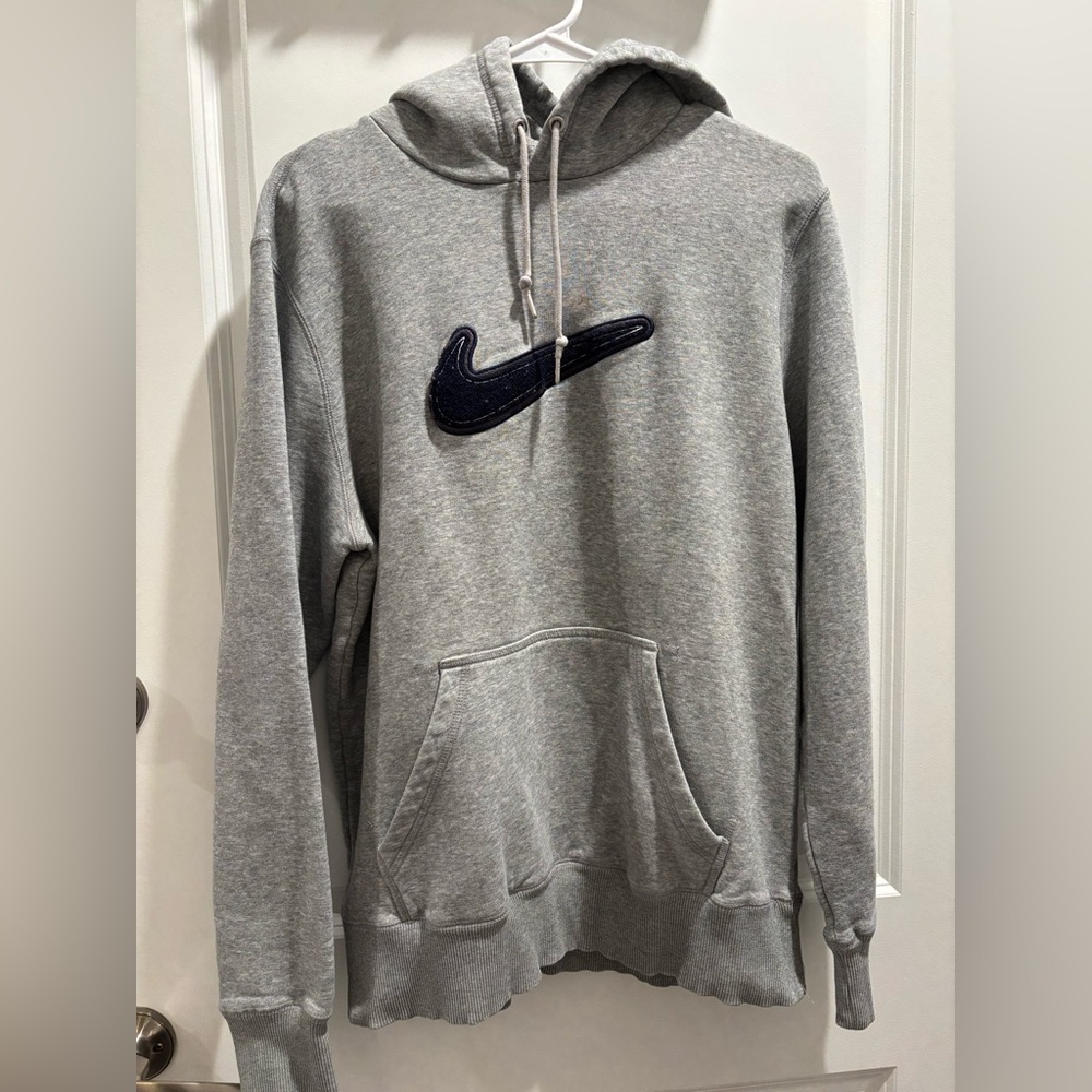 Grey Nike hoodie with embroidered swoosh
